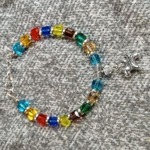 Glass beaded bracelet with charm